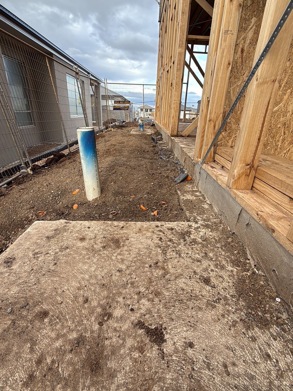 Block left ungraded, so rainwater runs back towards the slab, Sunbury