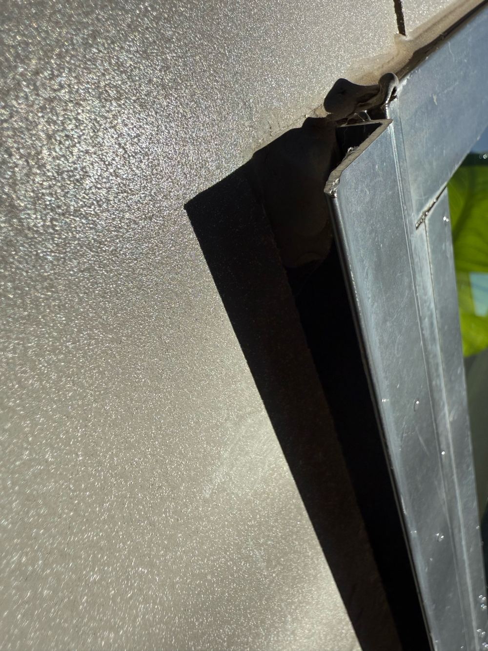 Gaps under the windows where the cladding meets the frame, found during a defect investigation in Bundoora