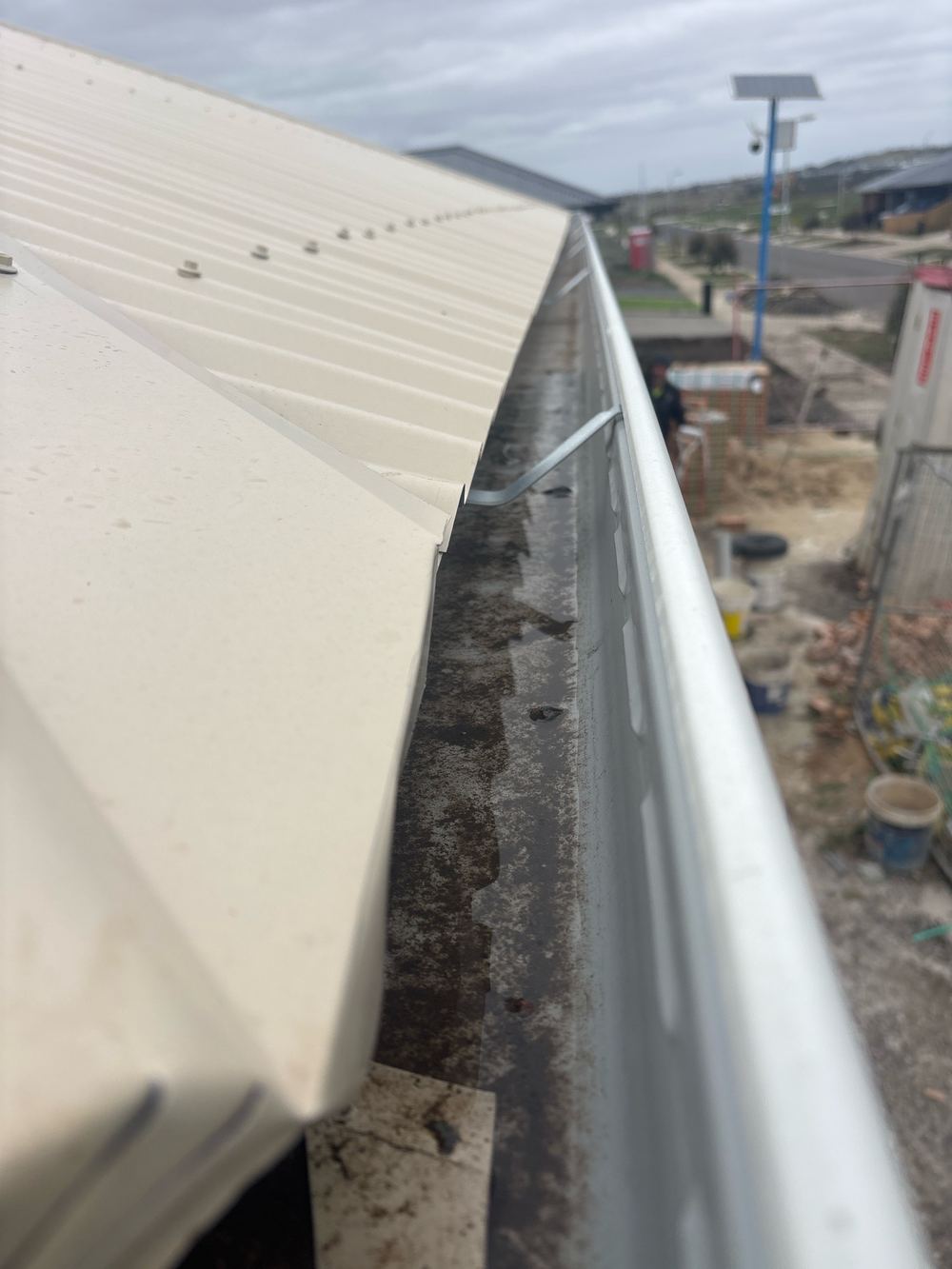 Gutter holding water because it lacks enough fall to drain, Sunbury