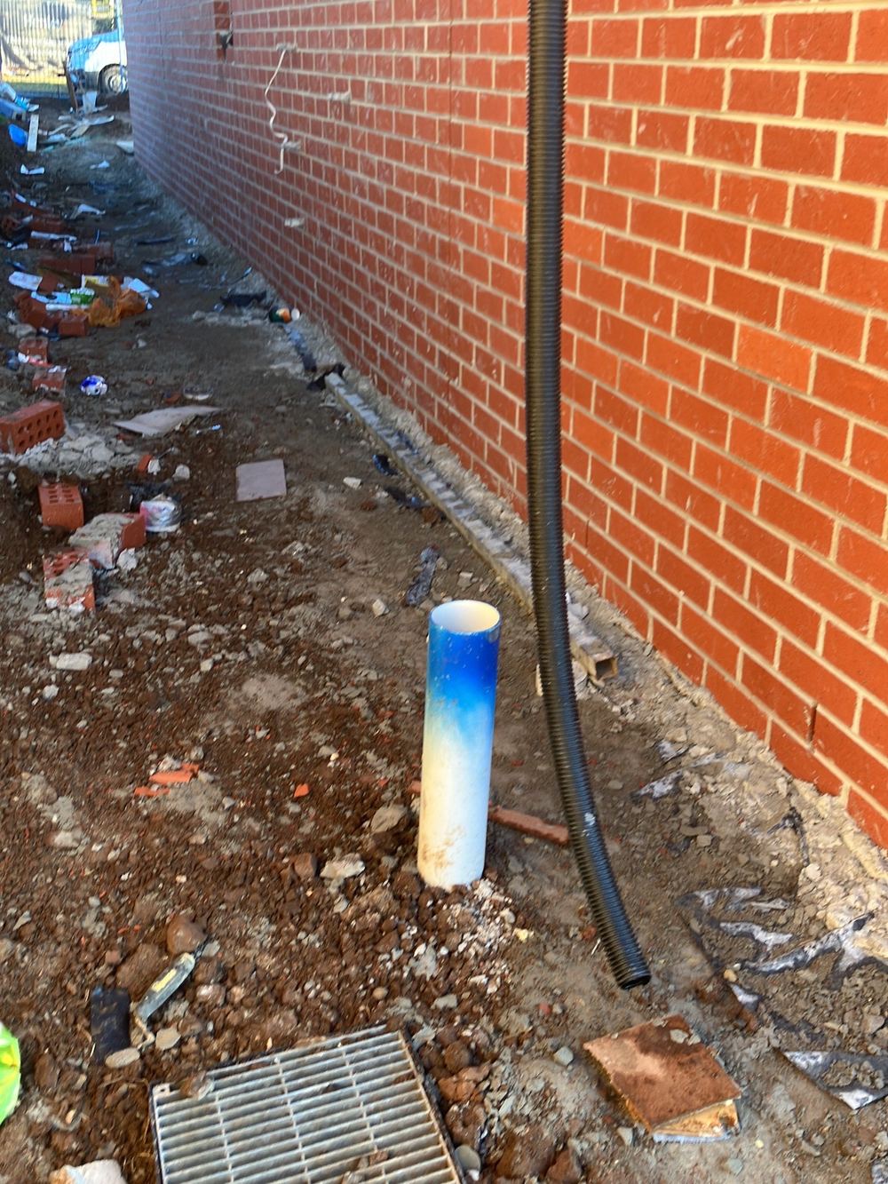 Stormwater pipe buried with too little soil cover over it, Sunbury