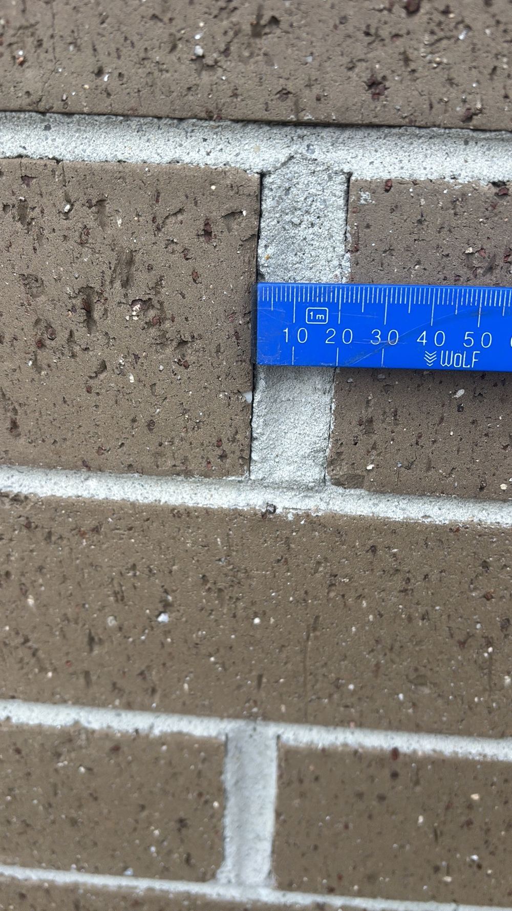 Brick perpends outside the 5mm to 15mm range, found during a pre-handover inspection in Sunbury