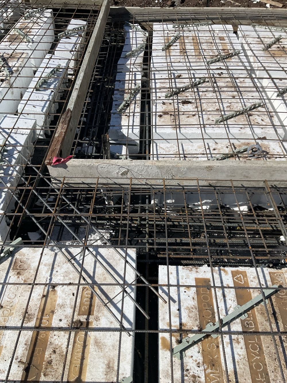 Beam width wandering along its run where pods had shifted out of line, found during a slab pre-pour inspection in Sunbury