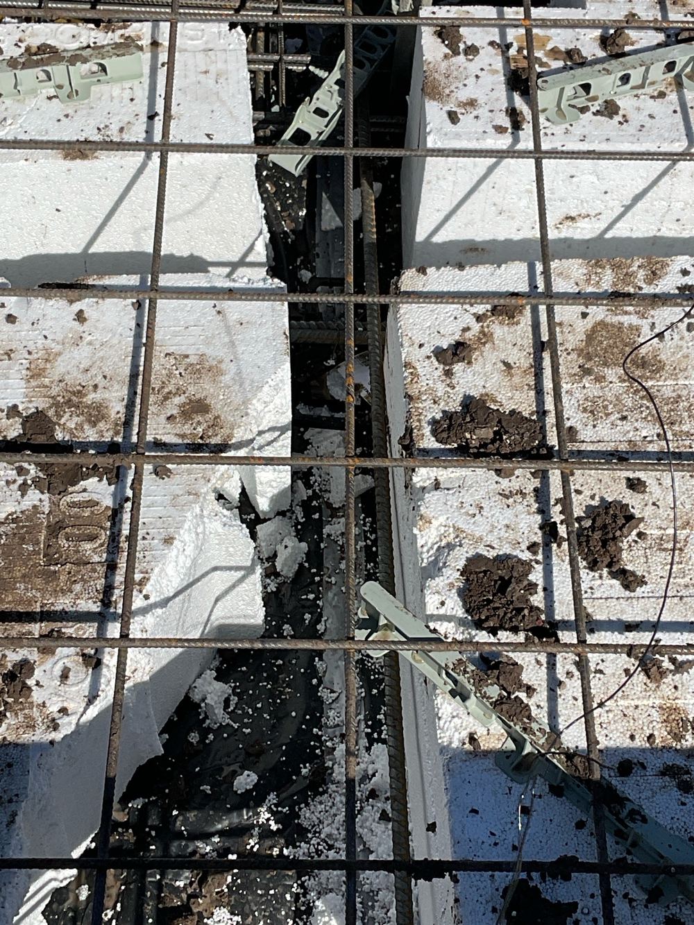 Steel sitting too close to the edge to get the concrete cover it needs, found during a slab pre-pour inspection in Sunbury